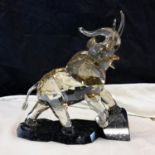 Swarovski crystal light sand Elephant sculpture mounted atop emerald pearl granite base, designed by