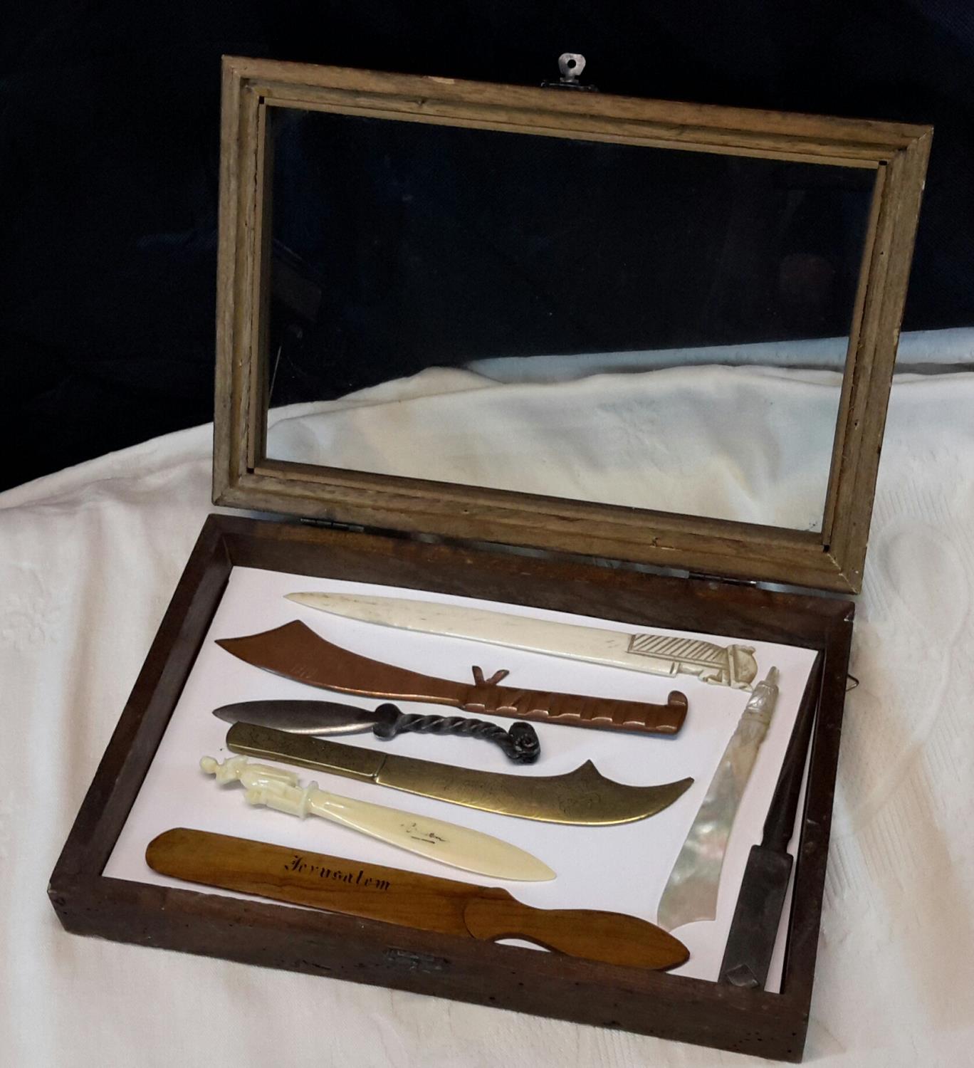 Small display cabinet with 8 various letter openers