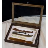 Small display cabinet with 8 various letter openers