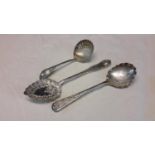 Three Sheffield silver serving spoons with ornate designs, two of which are named Mappin & Webb &