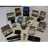 A selection of cuff links, 3 Car badges & cigar cutter etc