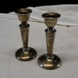 A pair of Birmingham silver candlesticks dated 1914