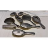 Nine silver dressing table items