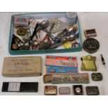 A collection of miniature advertising items includes gramophone needle tins.