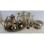 A selection of EP & Silver plated items to include candelabra, tea/ coffee service with a tray &