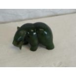 A jade figurine of a bear holding a fish in its mouth, 3cmx5cm
