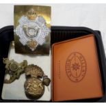 A Wills cigarette box and various military badges and buckle