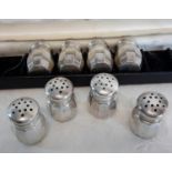 A set of 8 Empire sterling silver pepper pots