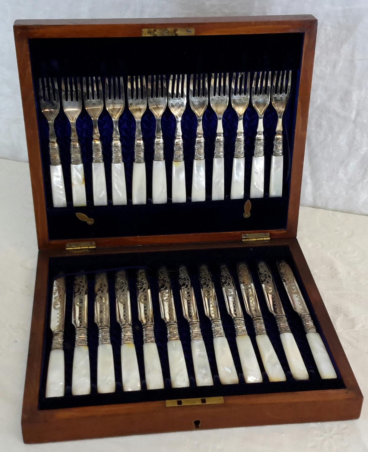 Mother of pearl & silver plated fork & knife set in its fitted wooden box