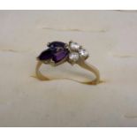 A 9ct gold ladies dress ring with cz and purple stone setting