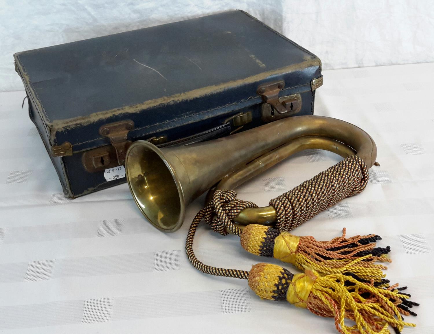 A military bugle with tassels & small blue case