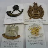 The Highland light infantry badge, sottish yeomanry badge, Royal Scots grey Waterloo badge & 1 other