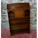 Dark wood 1950's bookcase with single door storage, 107x70x22cm