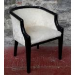 A 20th century tub chair with material upholstery & stud detail