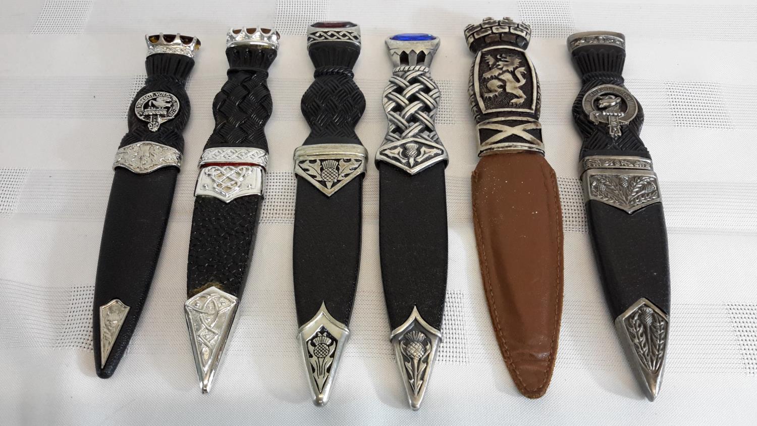 A collection of six sgian dubh with blades & sheathes