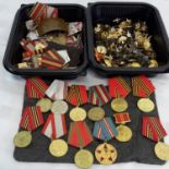 A collection of military Russian medals, star pins & badges etc
