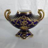 A Royal Crown Derby two handled urn vase with Gilt trim and hand painted. 9cm in height