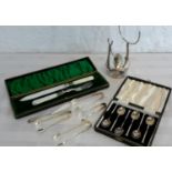 A mother of pearl handled serving set with Sheffield silver collars, various EP tongs, EP burner &