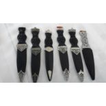 A collection of six sgian dubh with blades & sheathes