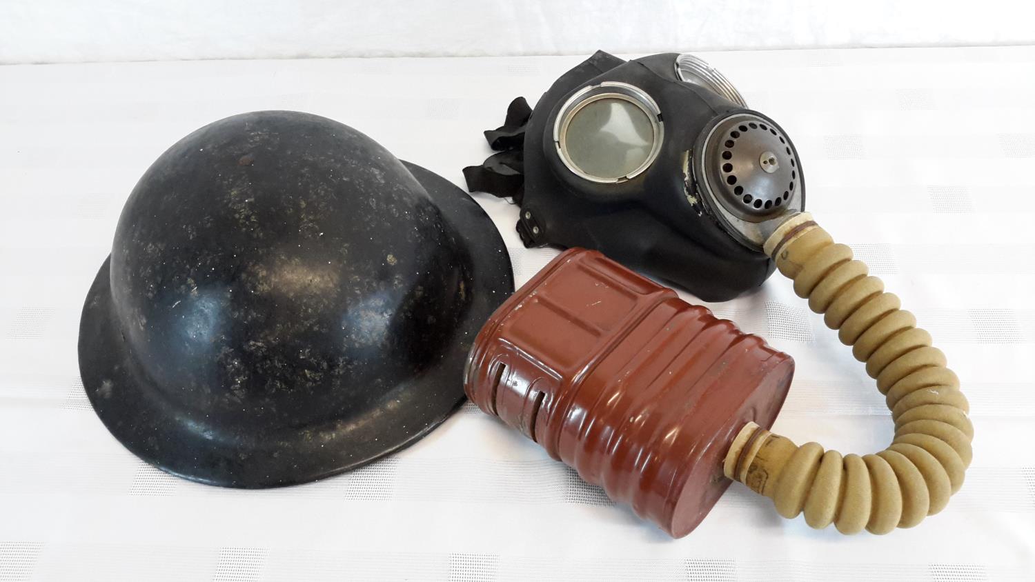 WW2 1940 gas mask, together with British WW2 plasfort helmet