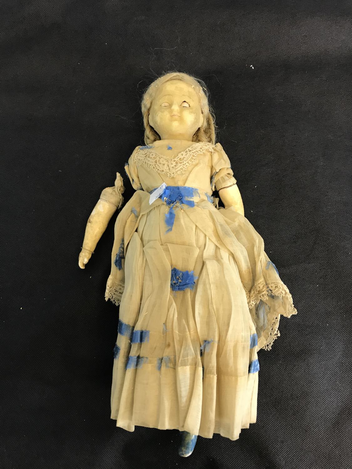 An 19th century bisque style doll (damaged)