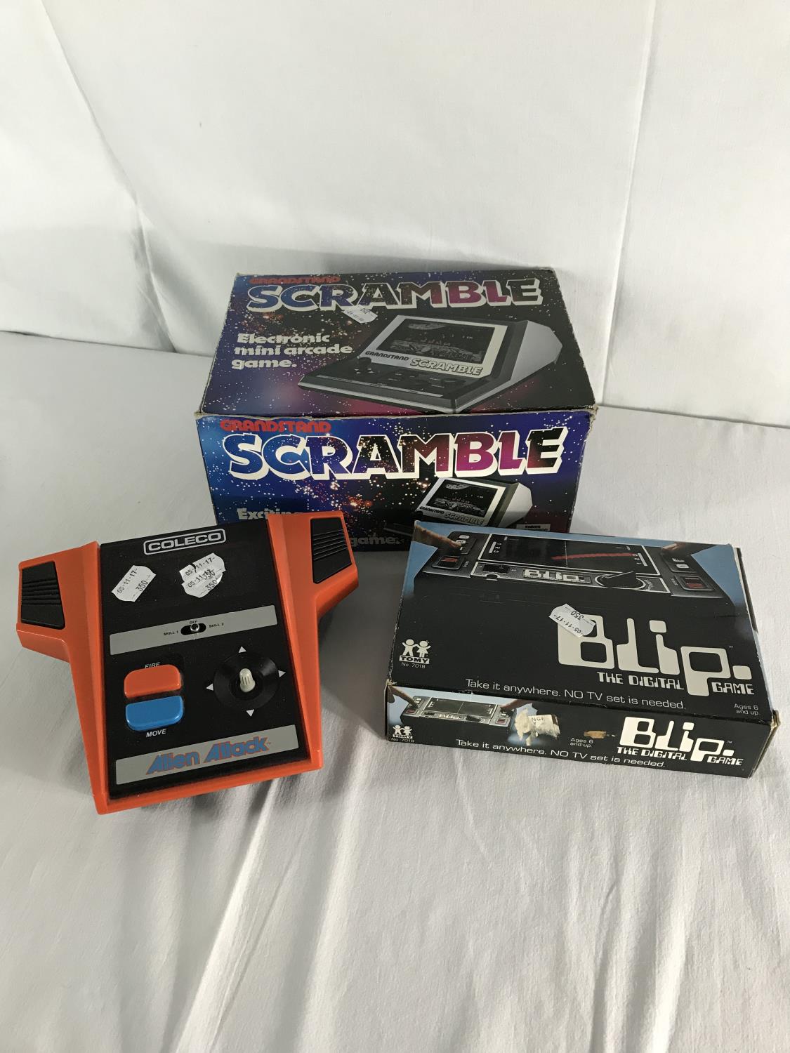 3 Vintage hand-held console games, 2 have boxes.