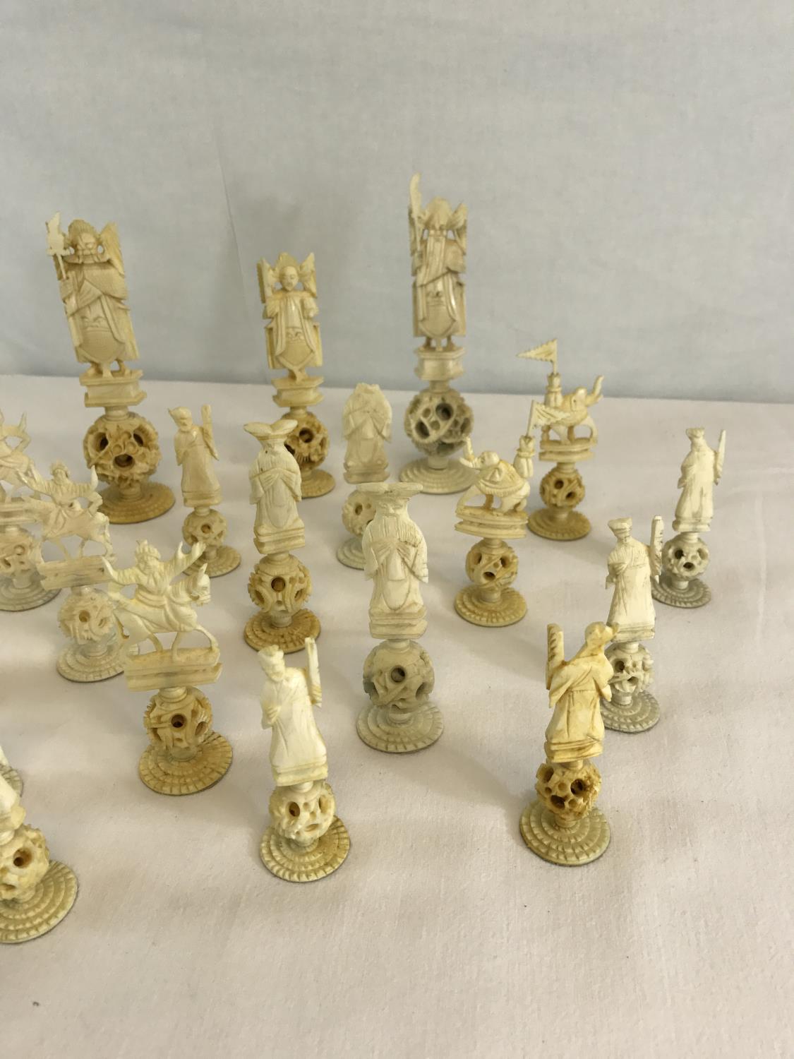 A collection of Oriental hand carved bone puzzle ball chess pieces - Image 2 of 3