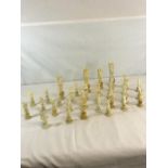 A collection of Oriental hand carved bone puzzle ball chess pieces