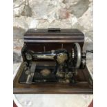 Antique Jones sewing machine with lid