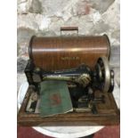 Antique singer sewing machine model V27K/128K with booklet