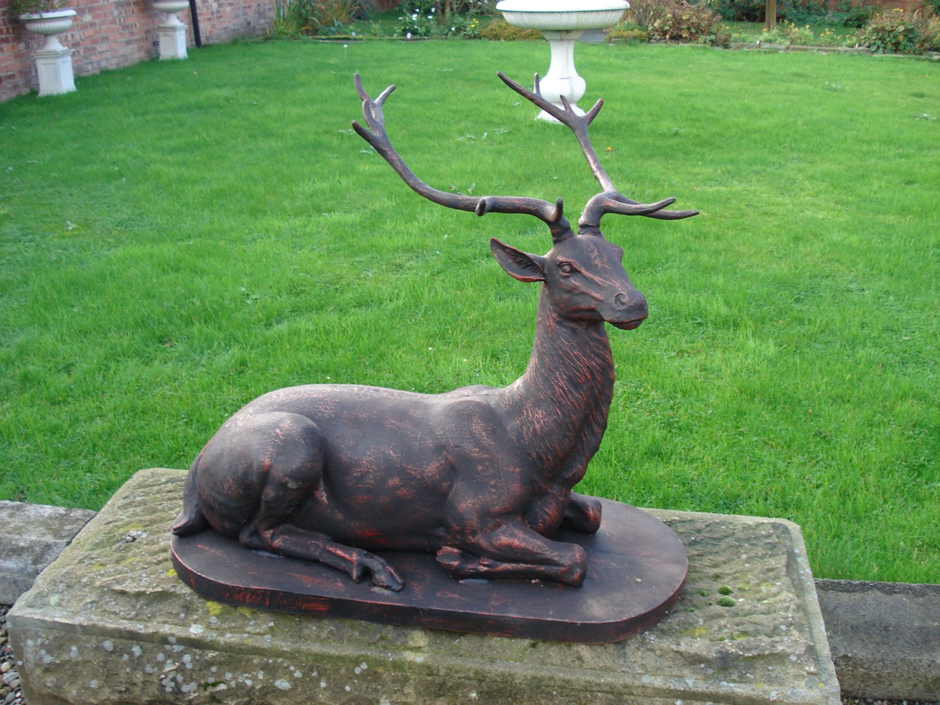 LIFESIZE NEW PROFESSIONAL CAST IRON STATUE OF A DEER LAYING ON PLINTH IN BRONZE FINISH