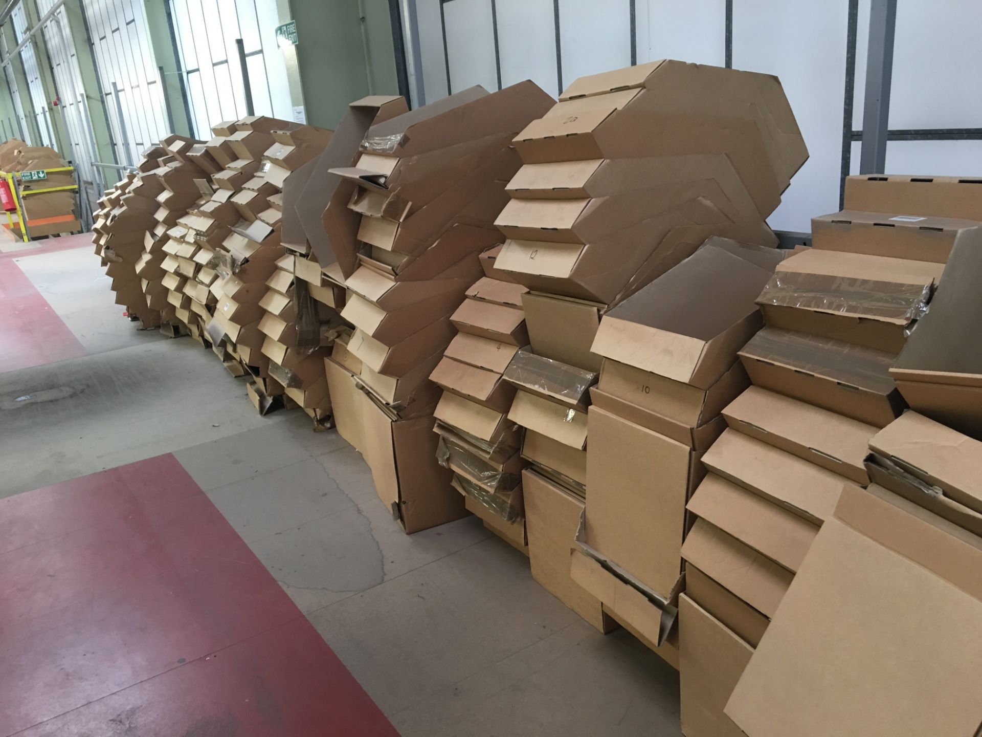 Large quantity of cardboard stock containers.