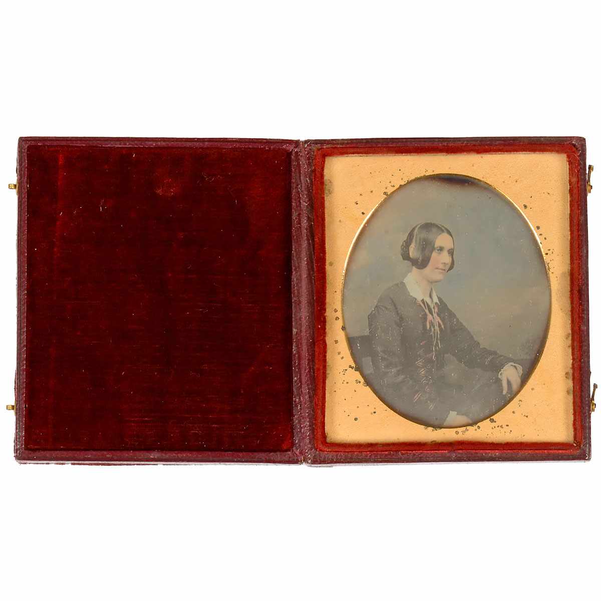 Daguerreotype, c. 1845 Anonymous. 1/6 plate, portrait of a lady, hand-tinted, brass passe-partout,