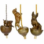 3 Electrical Table Bells Depicting Dogs, c. 1910 Bronze. 1) Viennese-style dachshund, height 3 1/6