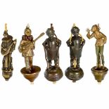 5 Figural Table Bells, c. 1910 and later 1) Nonchalant female figure, in 1920s style, with bob and