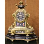 A 19th Century ormolu striking mantel clock, retailed by Boxell, Brighton, decorated with flowers