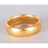 An 18ct gold wedding band, 6.2g