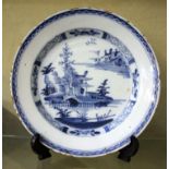 A blue and white plate decorated with pagoda, 22cm in diameter (af)