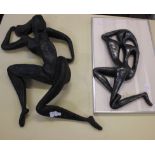 A modern sculpture of a reclining female nude and another similar (2)