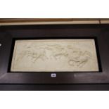 A carved relief plaque of horsemen, framed, 28cm x 66cm, 60cm x 100cm (including frame)