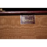 A lady's travel bag, by Harrods Tanner Krolle, and three leather suitcases