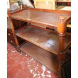 A Victorian mahogany three tier buffet with ring turned supports 111cm high, 117cm wide