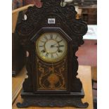 A late 19th Century American eight day spring strike oak wall clock, Waterbury & Co, a rosewood