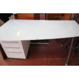 A modern desk with asymmetric glass top and drawers 75cm high, 150cm wide
