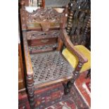 Two 17th Century style oak high back chairs and a carved armchair