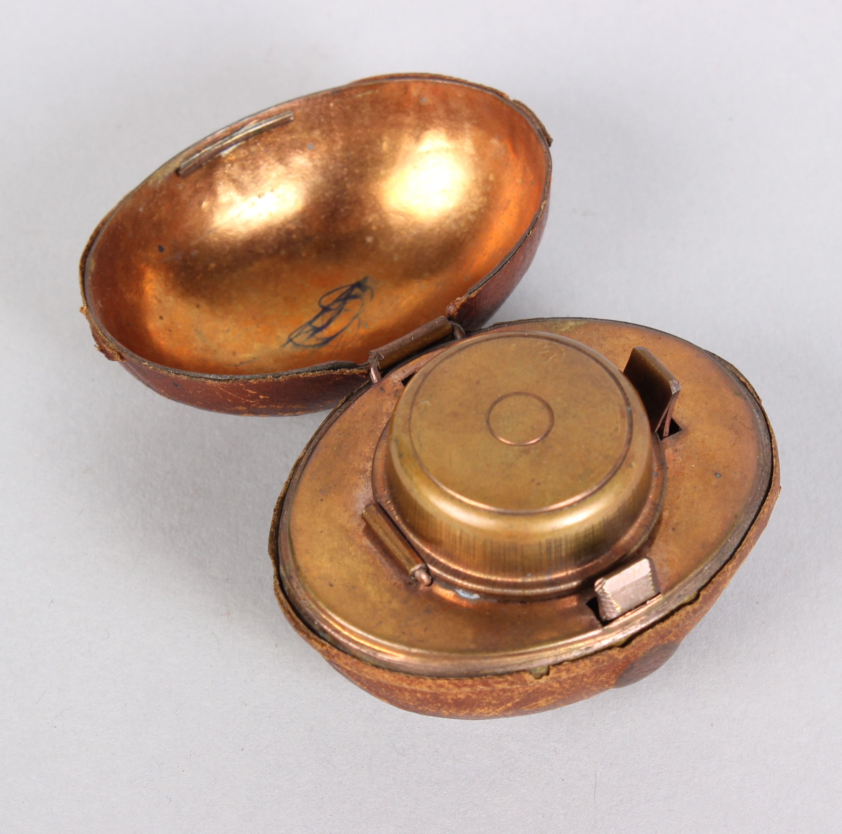 A Victorian novelty travelling inkwell, shaped as an American football covered in dark tan - Image 2 of 3