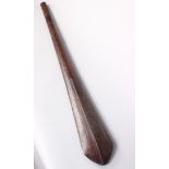 A Solomon island wooden paddle club, of eliptical spatulate form with medial ridges to the blade,