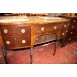 A 19th Century mahogany bowfront sideboard, a short drawer and tambour fronted cupboard flanked by