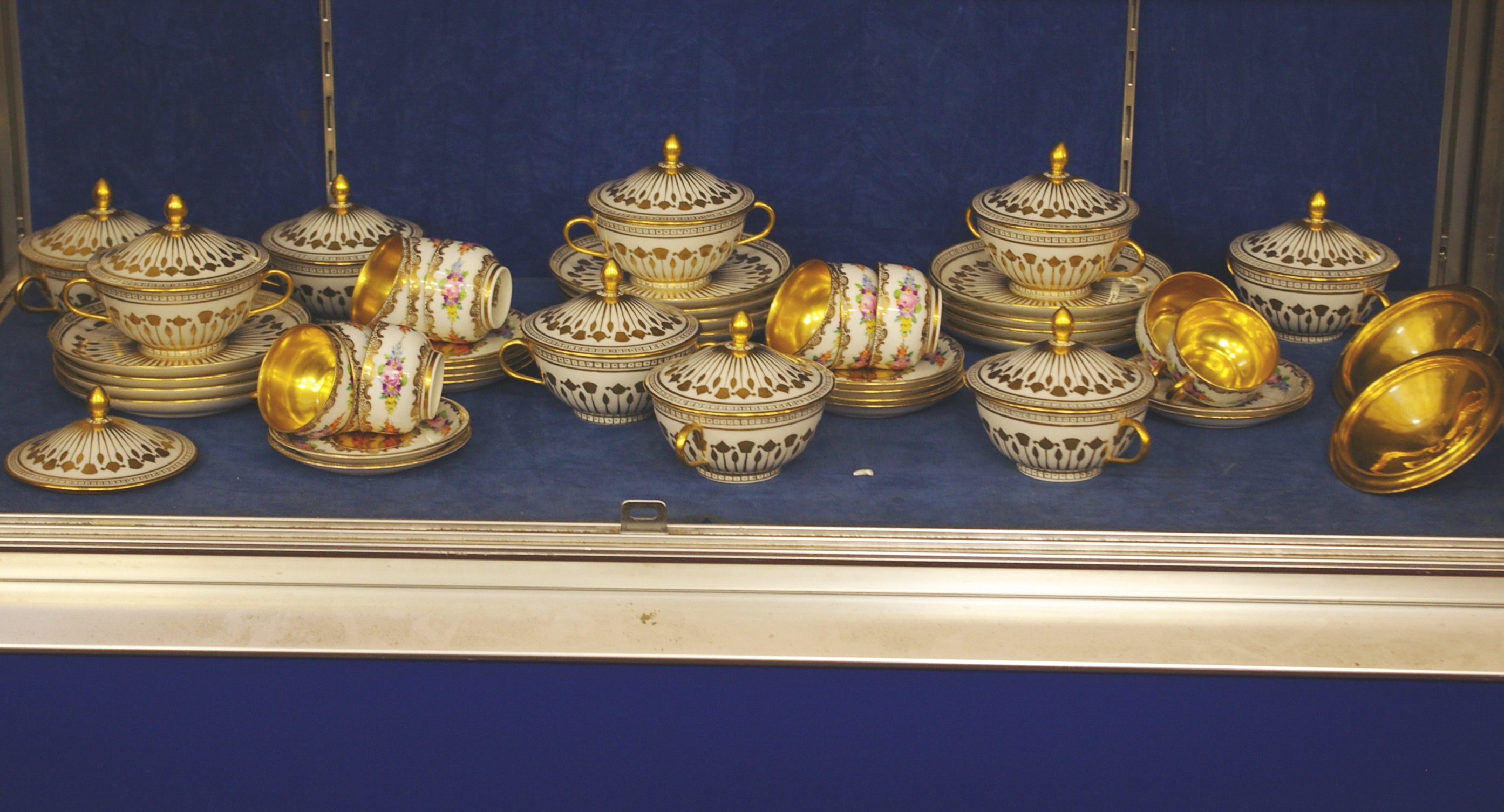 A French part tea service, gilt and floral decoration