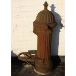 A Victorian cast iron water pump (lacking arm)